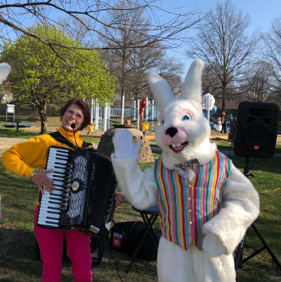 Jane with the Easter Bunny at the outside Bunny Eggstravagnaza on a beautiful spring day